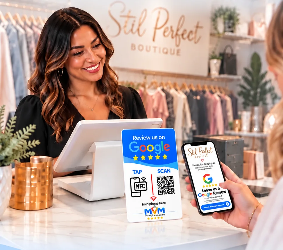 A boutique owner at her counter while a customer scans the My Voice Matters sign and her branded review page opens on the phone